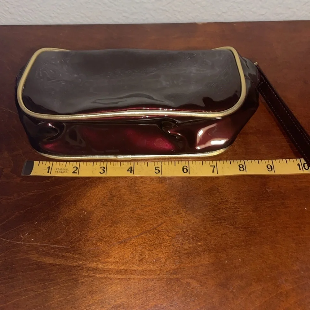 Avon Irridescent Burgundy PVC Make Up Bag Wristlet Gold Trim 2003 NOS